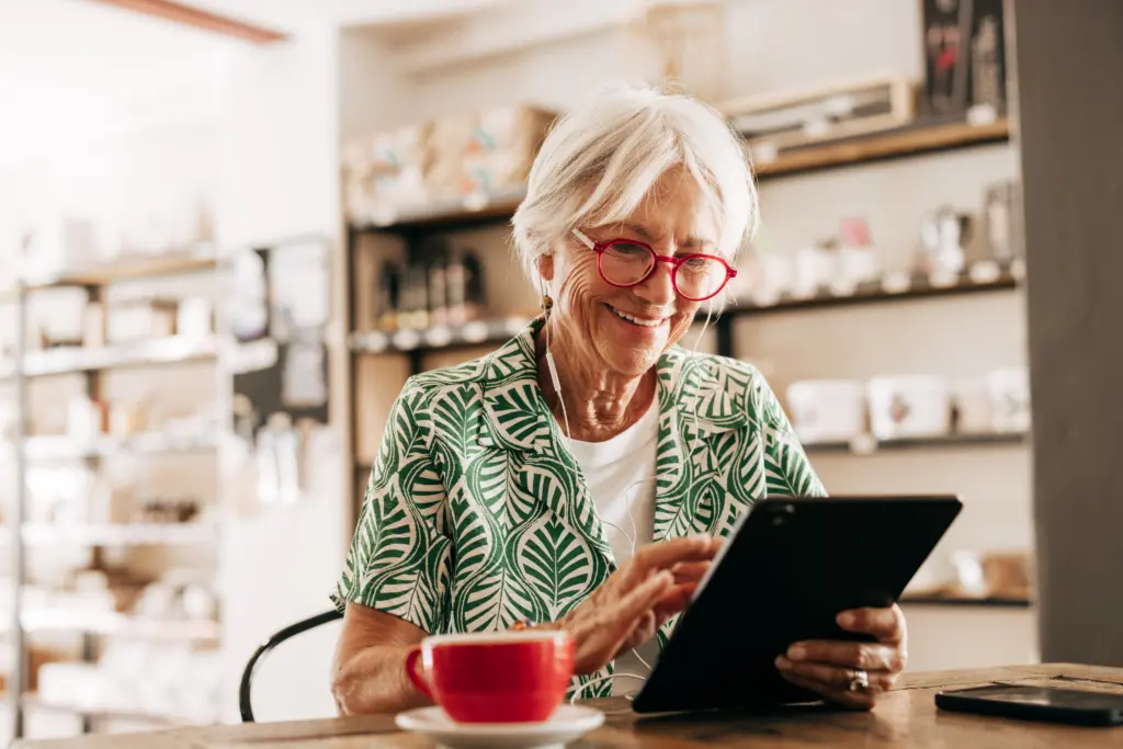 Woman at desk with electronic device - retirement planning at Futures Assured