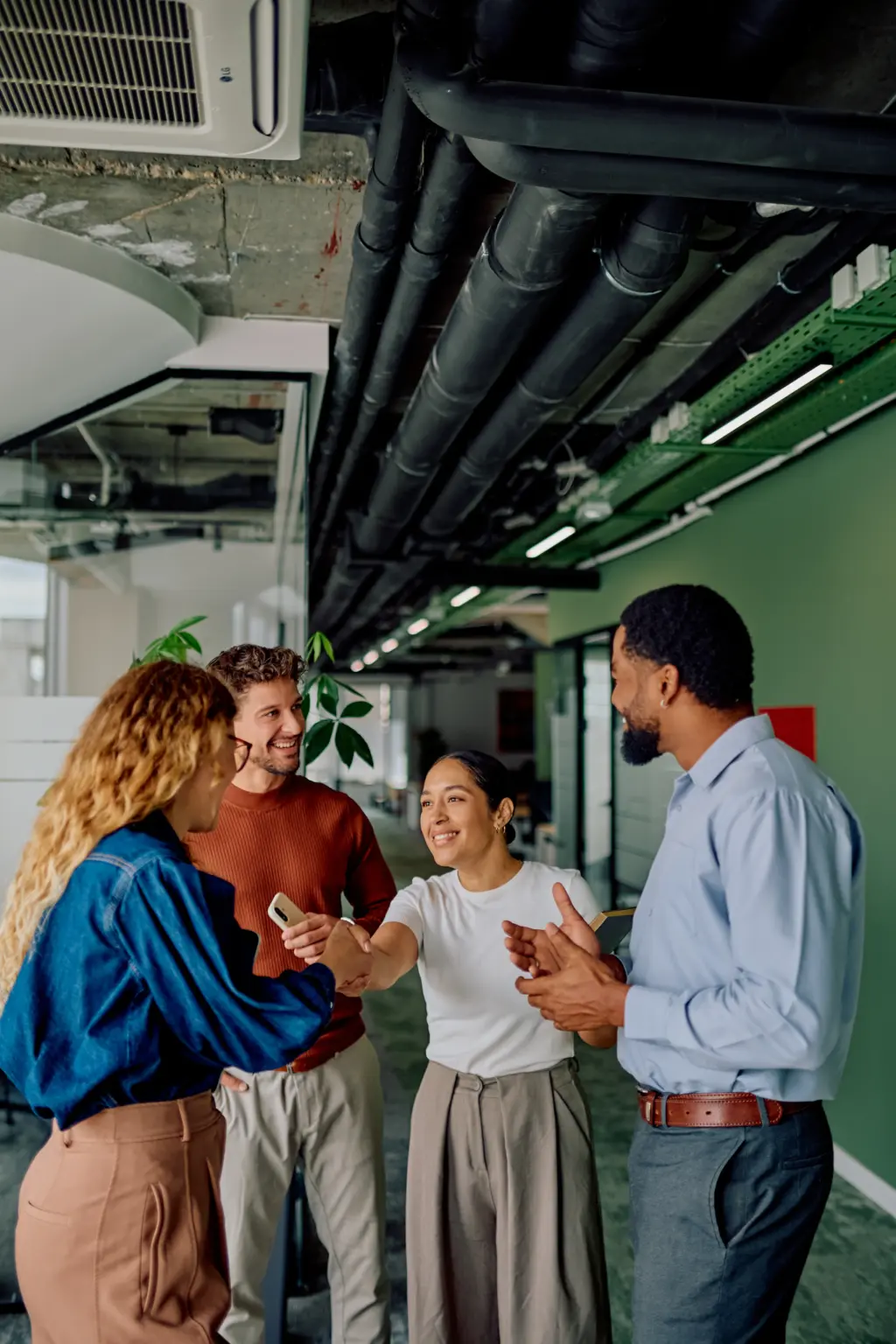 Group of people talking in an office - trusted financial advice from Futures Assured