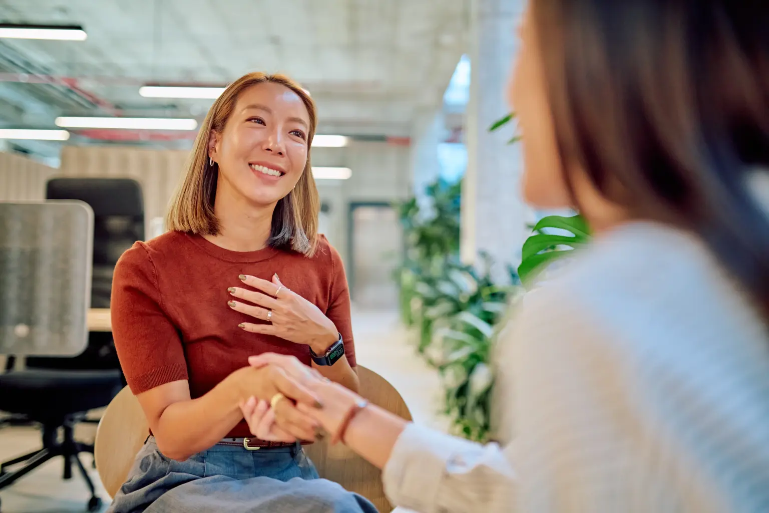 Two women shaking hands - trusted financial advice from Futures Assured