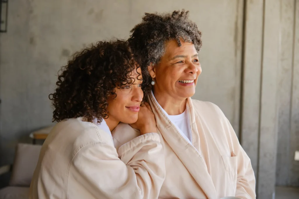 Mother and daughter on sofa - Planning for retirement at Futures Assured with trusted expert financial advice